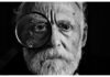 the way we say “hello” grayscale photo of man using magnifying glass