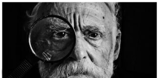 the way we say “hello” grayscale photo of man using magnifying glass