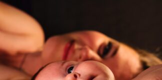 Eulogy For A Mom From A Son shallow focus photography of baby beside woman