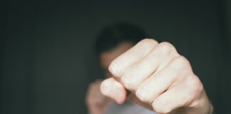 TJ person holding persons hand