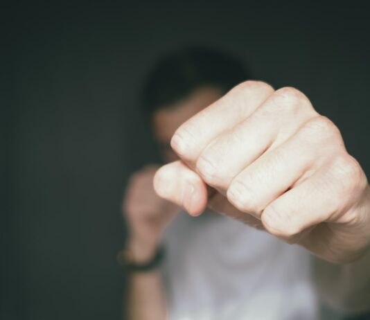 TJ person holding persons hand