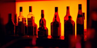 As the sun sets assorted bottle on table
