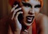 Bitchy little bitch Angry young androgynous person shouting while talking on smartphone